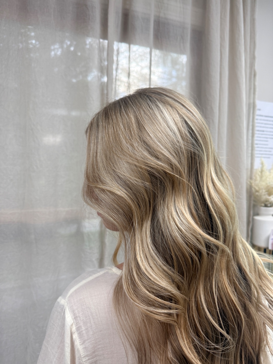 Soft blonde balayage, lived-in through the ends.